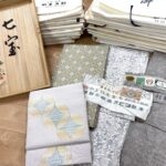 京都市北区のお客様より、訪問お買取りにて、北村武資さん、細見華岳さんの帯、本場結城紬、大島紬のお着物などを高価お買取りさせていただきました。